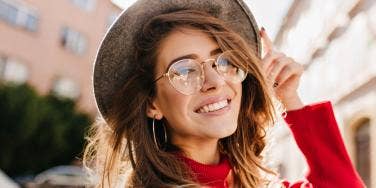 woman smiling with glasses on