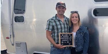 Inspiring photo of Heather and husband Austin captured in front of their Airstream