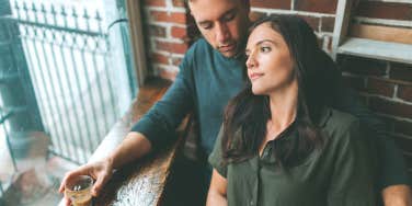 man and woman having drink at restaurant 