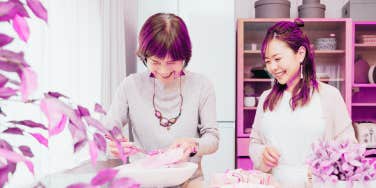 mom and daughter cooking in kitchen