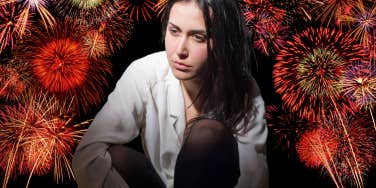 Woman feeling shame, surrounded by fireworks