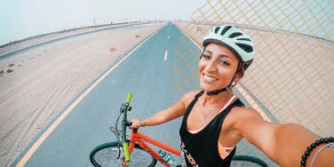 Woman taking a selfie on her bike ride 