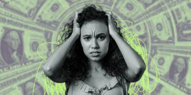 worried woman with dollars behind her