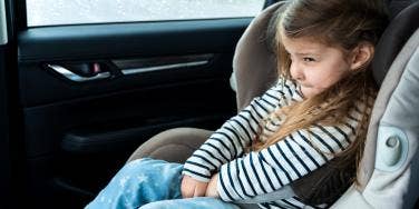 toddler girl in carseat