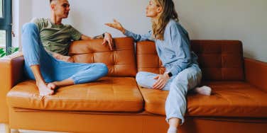 couple arguing on couch