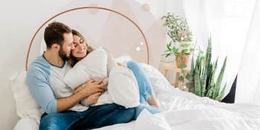 Couple staying at home snuggling