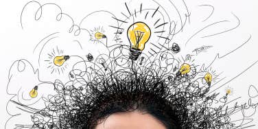 person with question signs and light idea bulb above their head