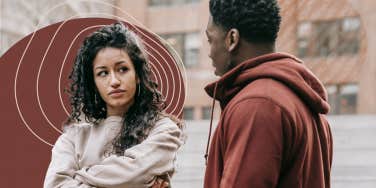 Woman looking disappointed at man