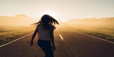 woman walking down road