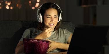 woman watching movie online together with someone far away