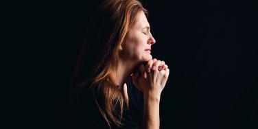 photo of mother in profile with black background