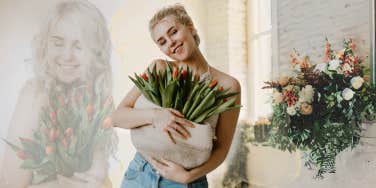 Smiling woman bringing home flowers she bought for herself 