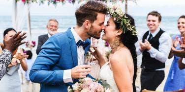 couple kissing at wedding