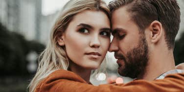 women and man hugging