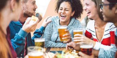 Woman at a brewery enjoying a adult beverage