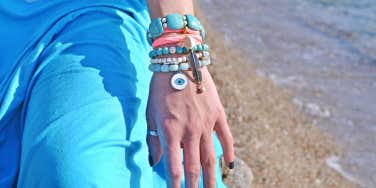 arm with evil eye bracelet