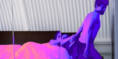 Woman pulling man back 