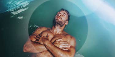 Man floating in sensory deprivation tank