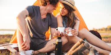 Couple camping outdoors