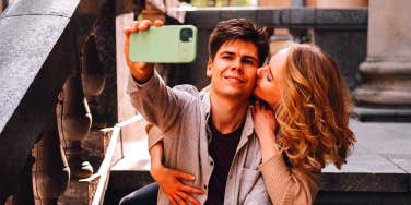 man taking selfie with woman