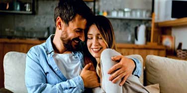 couple smiling on the couch