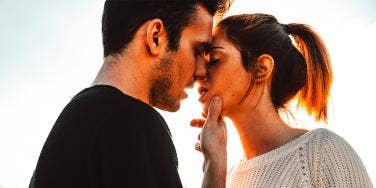 couple leaning in for a kiss