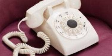 white telephone burgundy sofa 