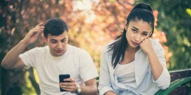 frustrated woman with man behind her