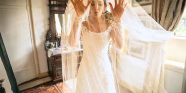 Woman in wedding dress, terrified of marriage, deep breathing