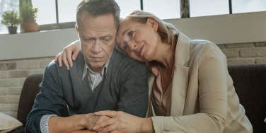 unhappy couple sitting together