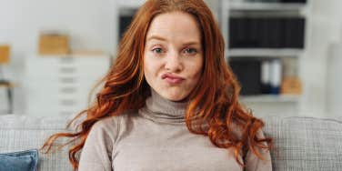 woman with unimpressed and annoyed facial expression