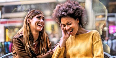 best friends laughing while at lunch