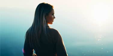 woman standing in sun