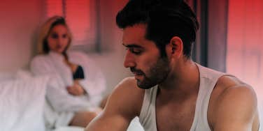 unhappy couple in bedroom