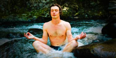 man breathing and meditating