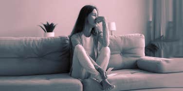 sad woman on couch