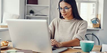 woman working on laptop at home
