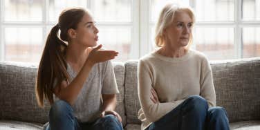 Frustrated (adult) daughter argues with her mother, displaying a generational divide between the women