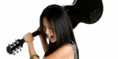 woman smashing guitar