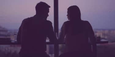 couple looking out window