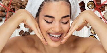 Woman smiling while doing skincare