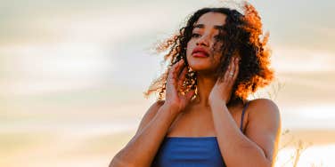 woman standing in sunset