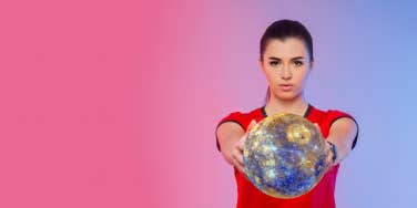 woman holding mercury in her hand