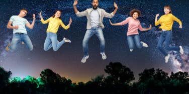 five people happily jumping