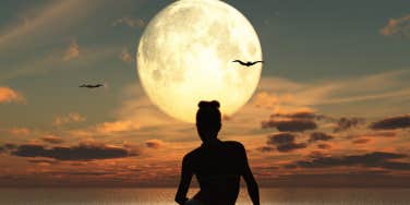 woman sitting by moon