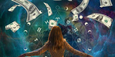 woman looking into space with money falling