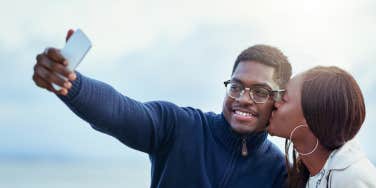 young affectionate couple taking a selfie