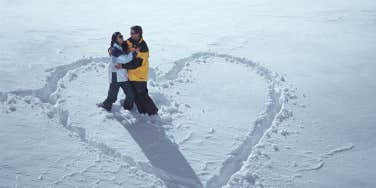 couple standing in a heart