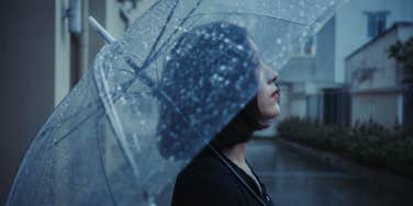 woman with umbrella in rain