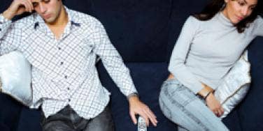 unhappy couple on couch